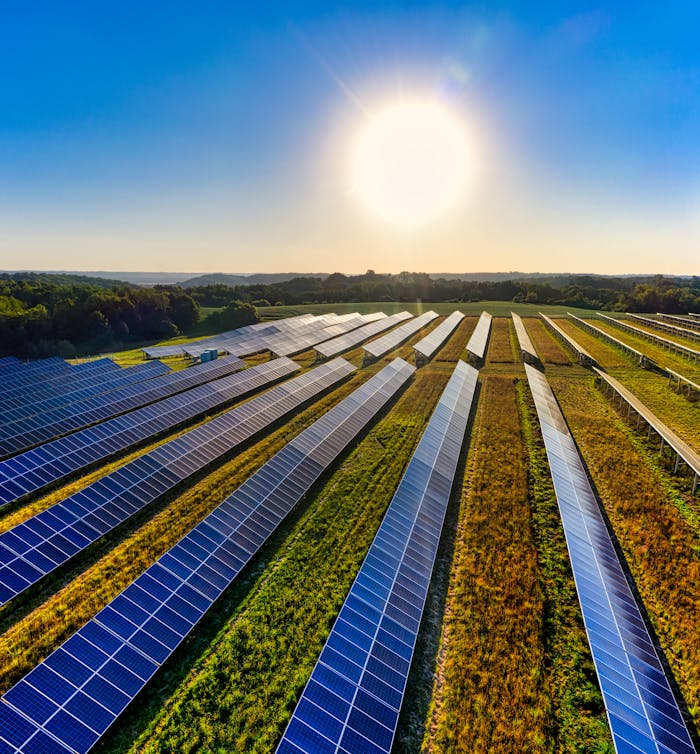 Aerial view of a solar farm in Red Wing, MN, with solar panels harnessing the suns energy.